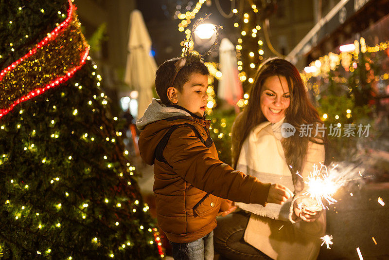 Mother and son outdoor. It's a Christmas time